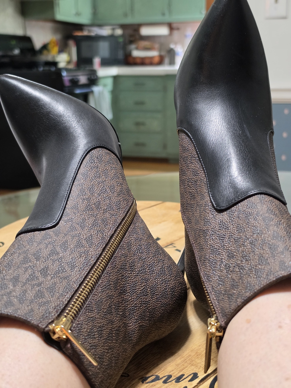 MICHAEL Michael Kors Black Leather and Brown Logo Ankle Booties